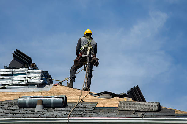 Professional Roof Replacement technician working in Wassaic, NY